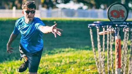 Student playing disc golf