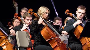 Students playing in the orchestra