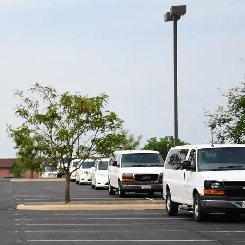 Cedarville University fleet vans parked bumper to bumper